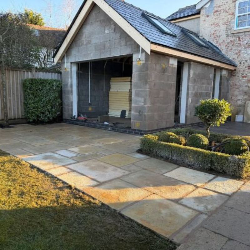Completed garden landscaping with lawn, paving, fencing and garden wall