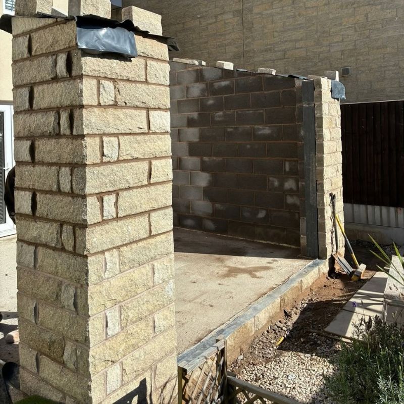 Residential brick building with a large opening during construction work