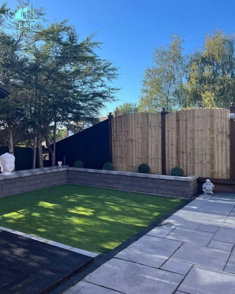 Completed garden landscaping with paving and timber fencing
