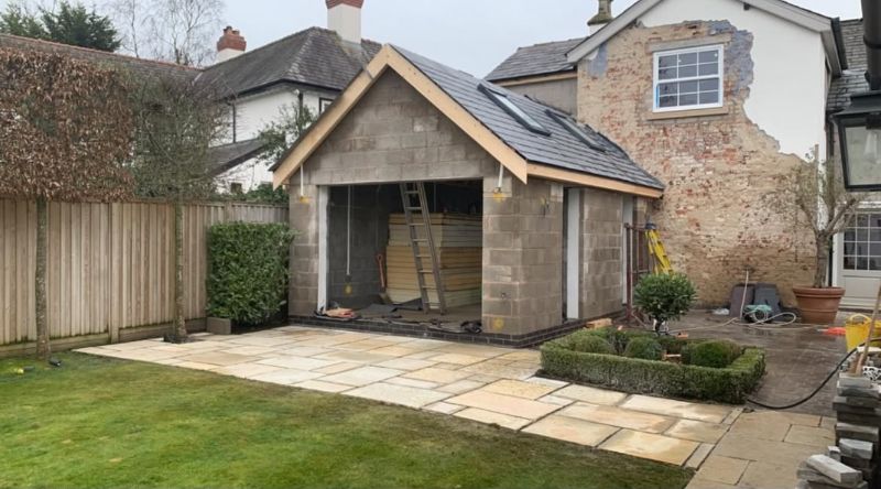 Detached garden room under construction with blockwork and pitched roof